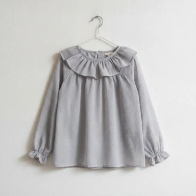 Blusa niña plumeti volante manga larga