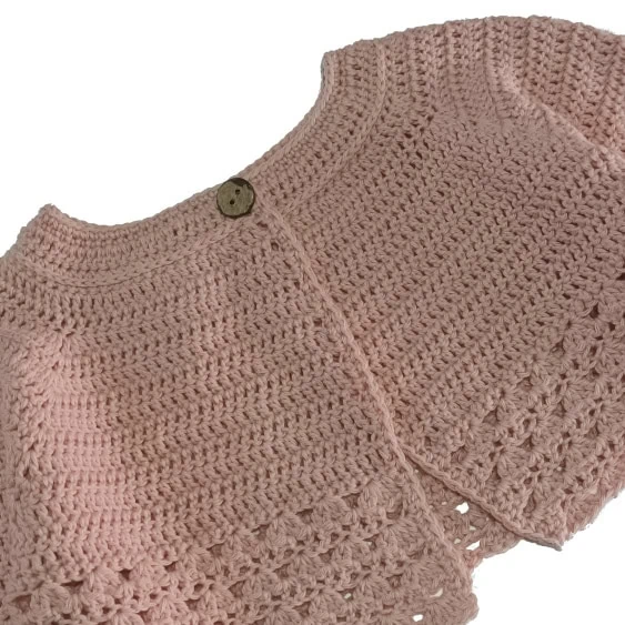 Chaqueta de punto para niñas tejida a mano artesanal mente melocoton